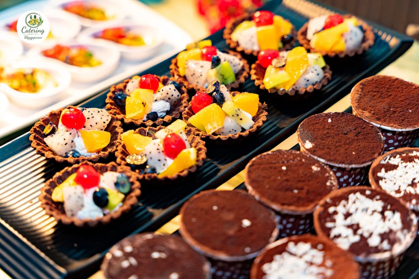 Fruit tarts and chocolate muffins